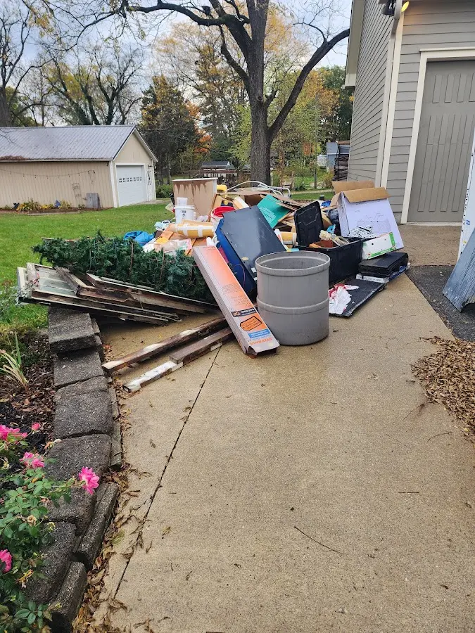 Dumpster being loaded with debris for 3 Yard Dumpster Rental in Struthers